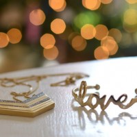 Maternity Portraits In Front Of The Christmas Tree