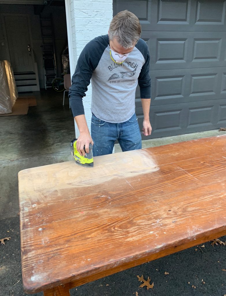John Sanding The Finish Off Wood Dining Table