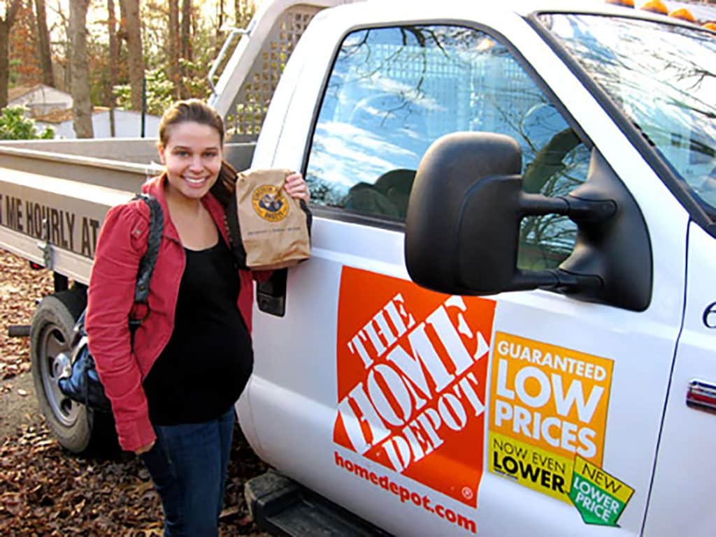 Pregnant Sherry next to Home Depot Rental Truck