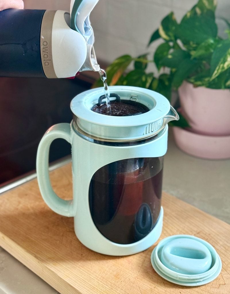 Adding Water Over Coffee Grounds In Home Cold Brew Maker