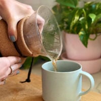 Pouring Pour Over Coffee Into Mug From Boden Maker