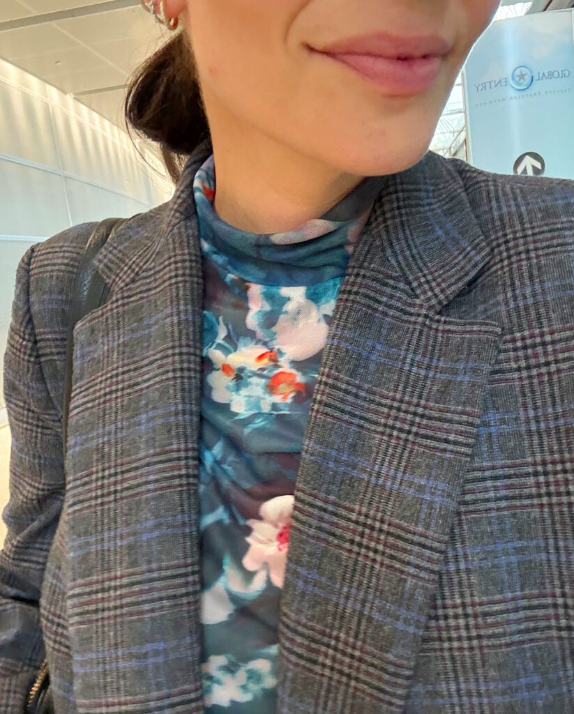 Close Up Of Floral Mesh Shirt Under Tweed Blazer